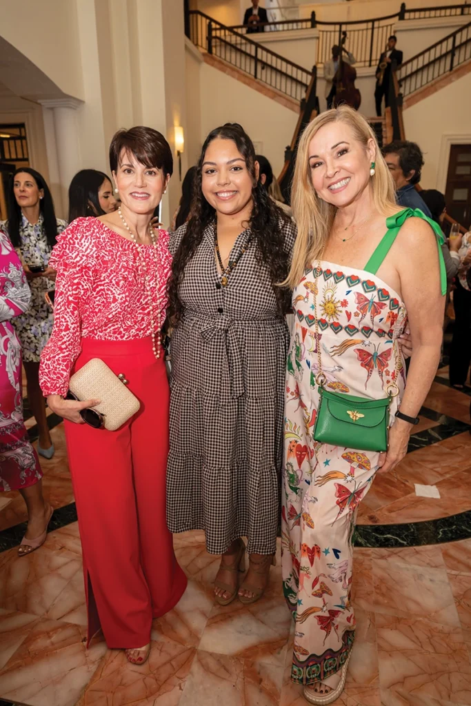 Three women smiling.