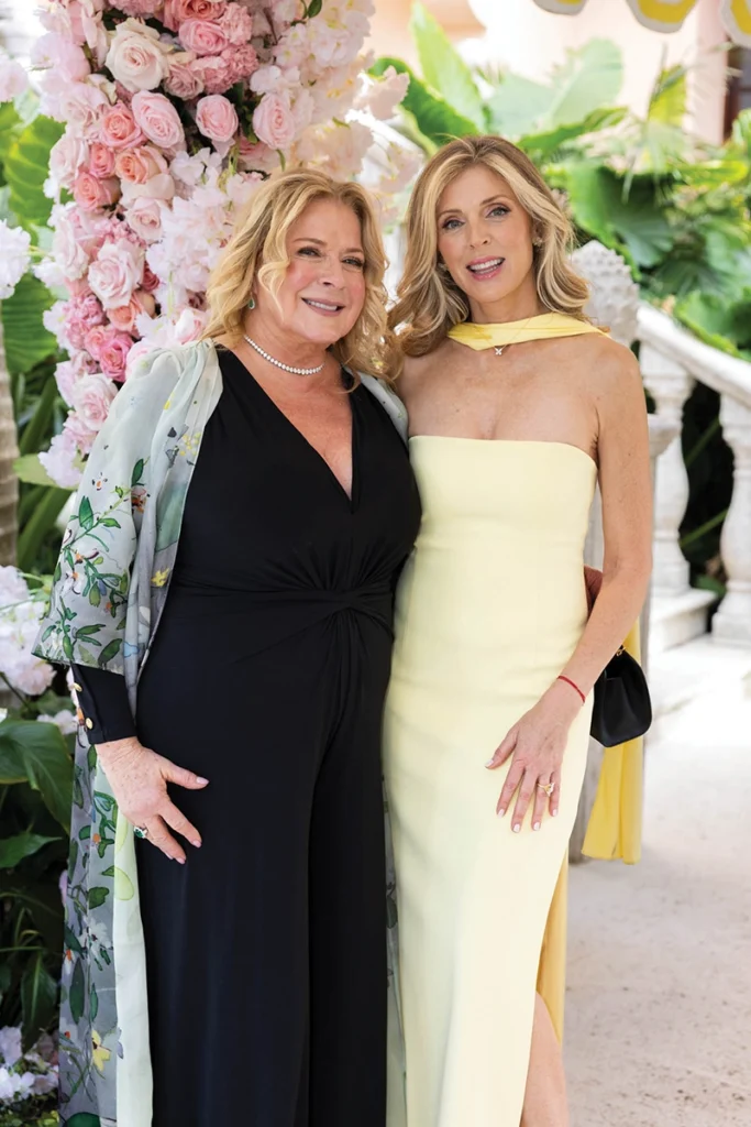 Two women smiling.