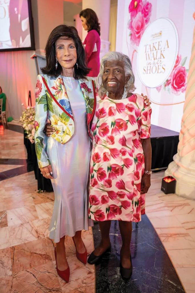 Two women smiling.