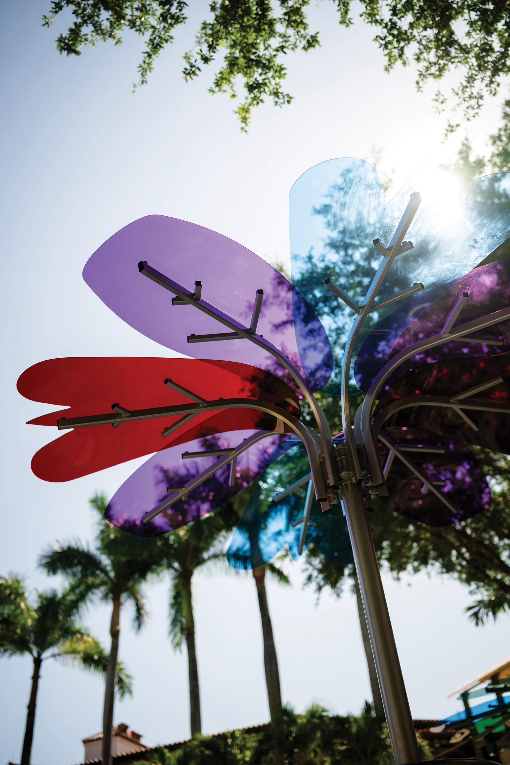 A flower sculpture against the sky.