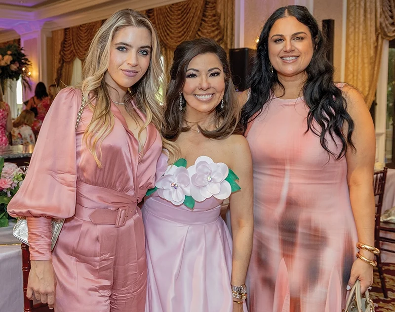 Three women smiling.