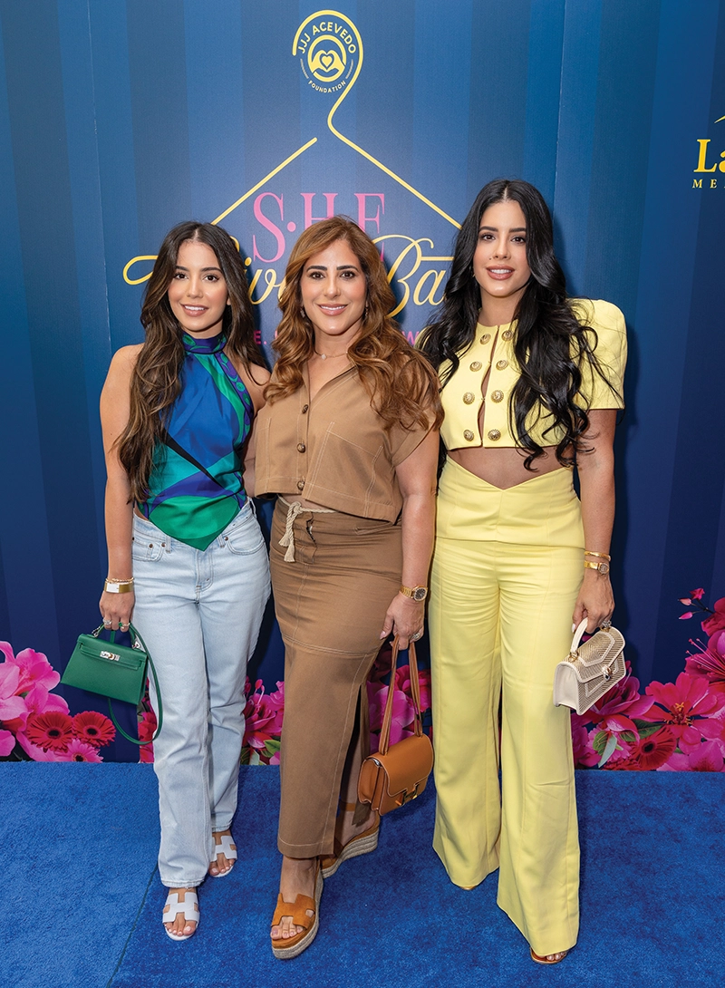 Three women smiling.