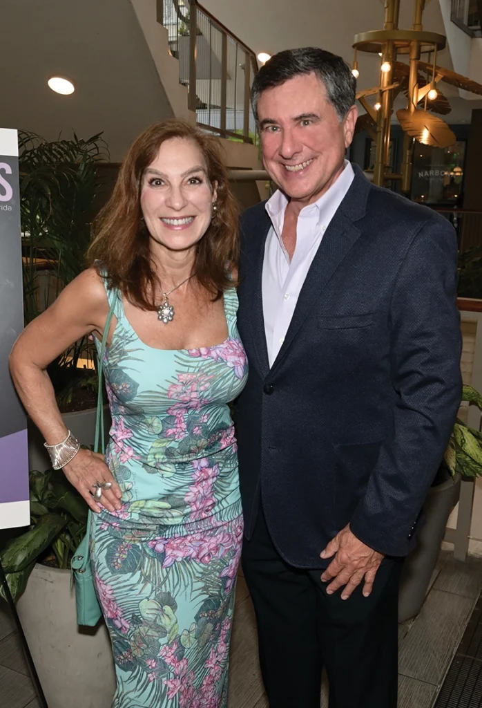man and woman smiling at camera