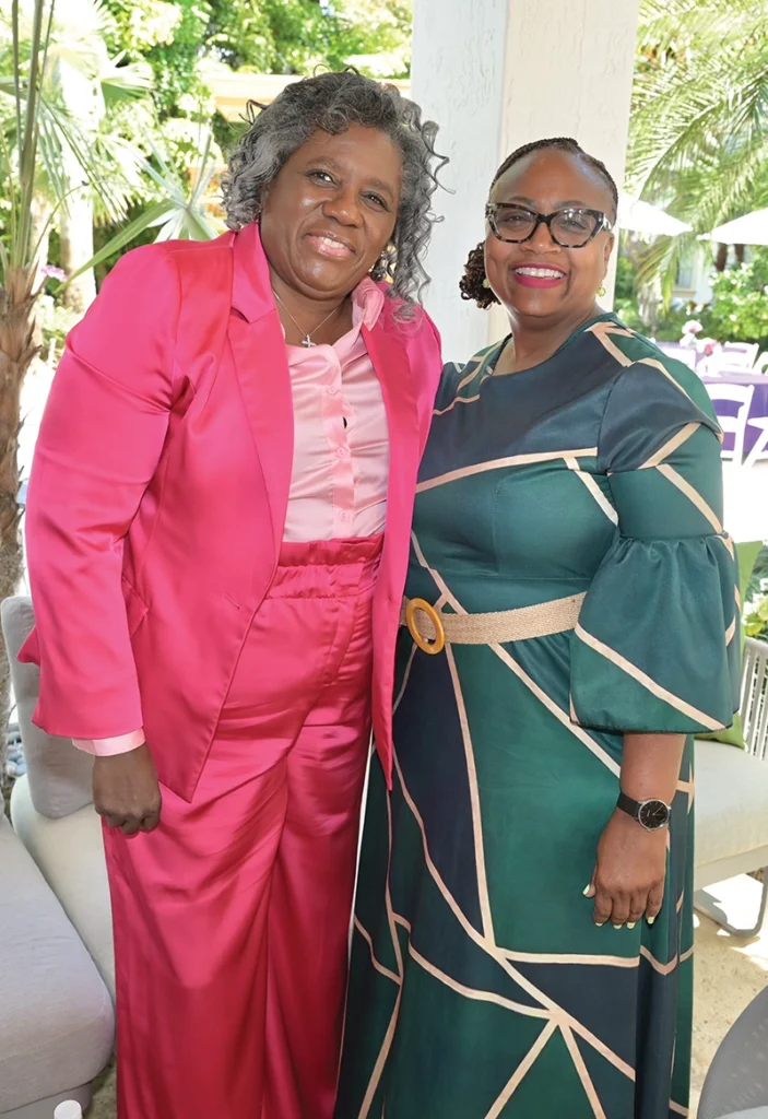 Two women smiling.